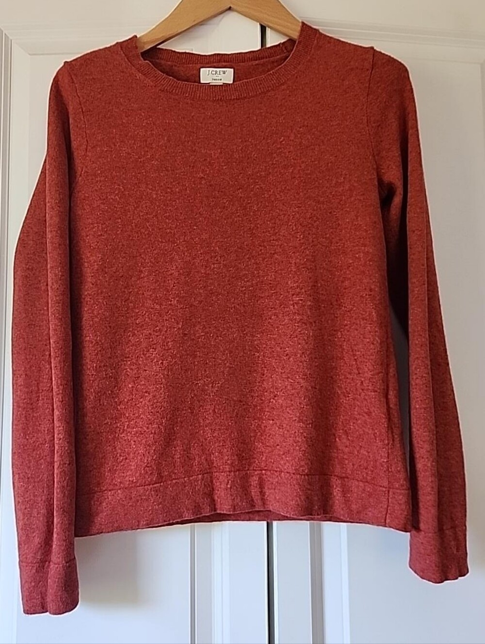 J.Crew Teddie crewneck sweater in a warm heathered rust / burnt orange color.